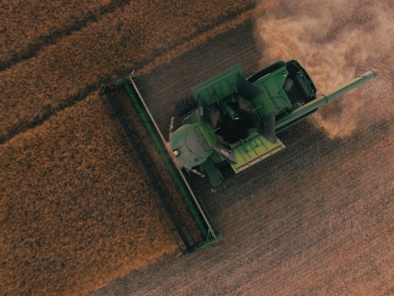 Bird's view of tractor harvesting field