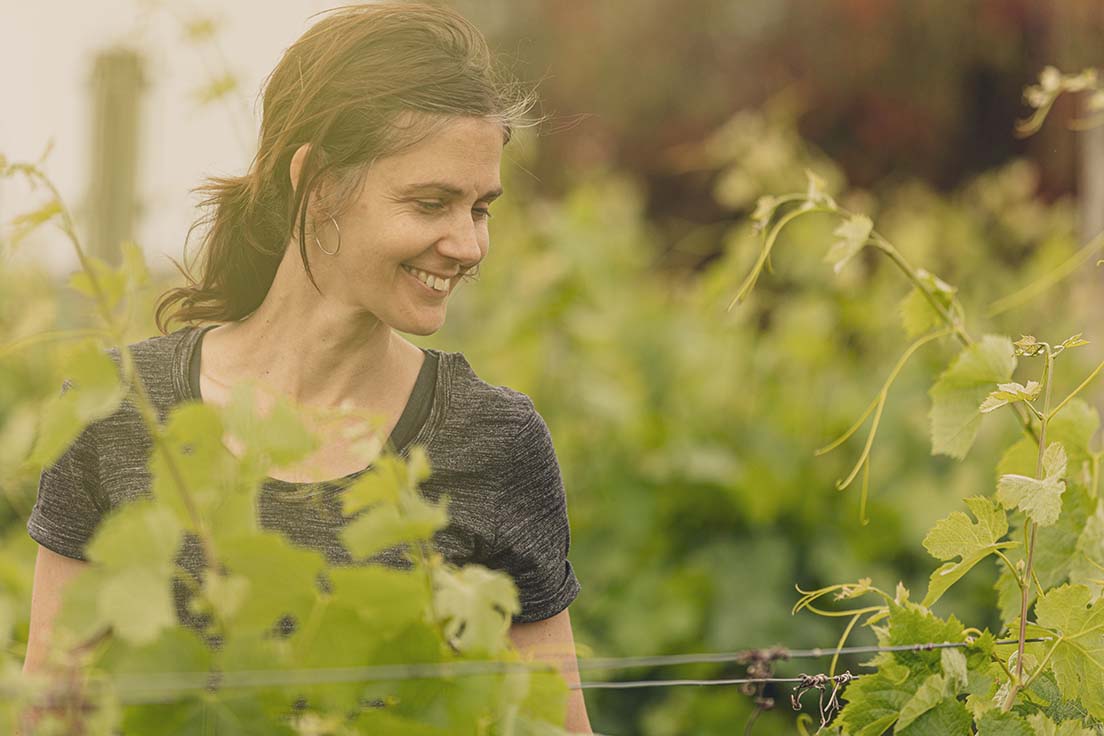 Woman smiling in vineyard